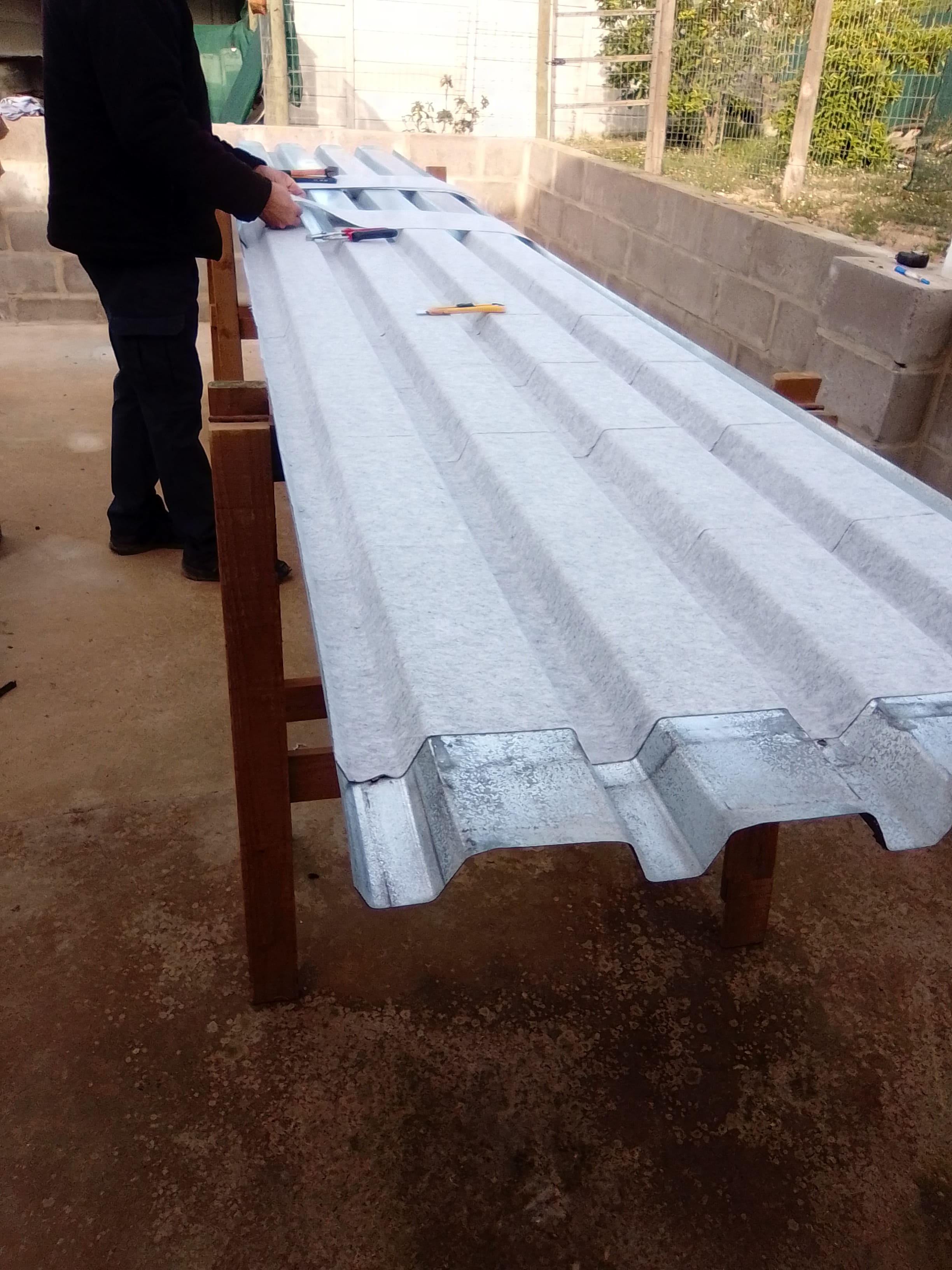 Dripstop anti-condensation membrane being installed beneath IBR roofing in Durbanville